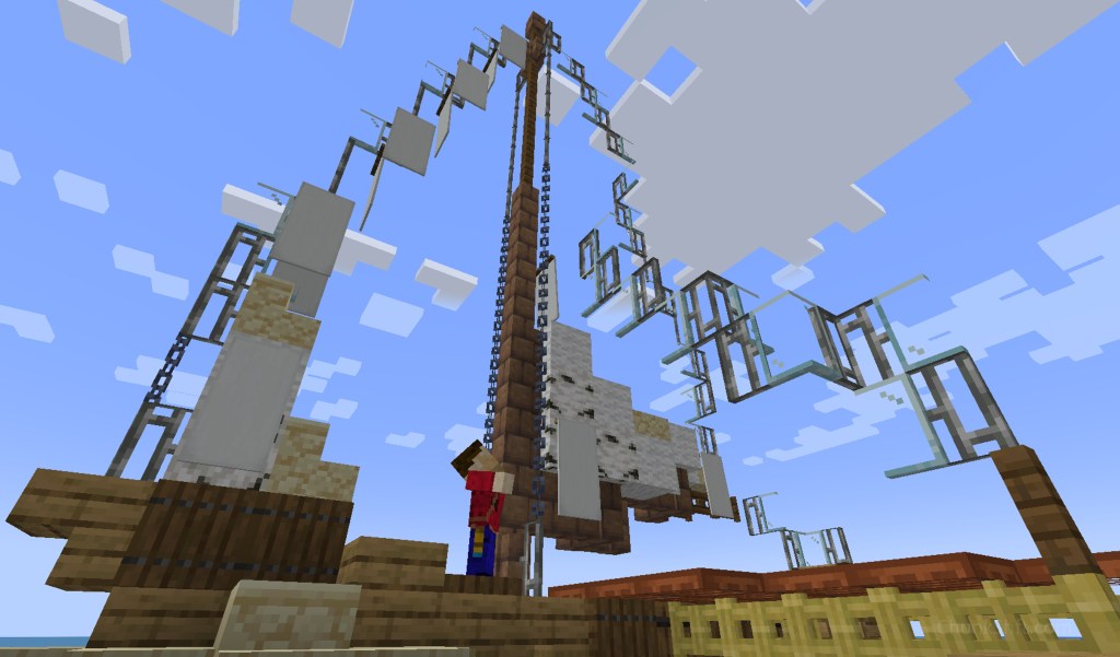 Player stands at foot of mast and appears to be pulling on the vertical ropes that run to the top of the mast.