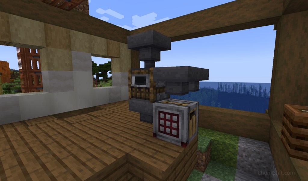 2 hoppers feed a smoker with a hopper pulling the cooked kelp into a crafter. This sits in the centre of a partially built structure. 