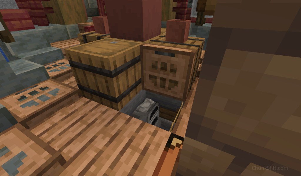 A furnace and some hoppers in the cargo hold can be seen through a trap door. These sit below barrels on the deck that serve as inputs for items and fuel.