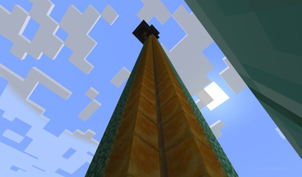 A column of prismarine and honey blocks rise into the sky from a drained ocean monument. 