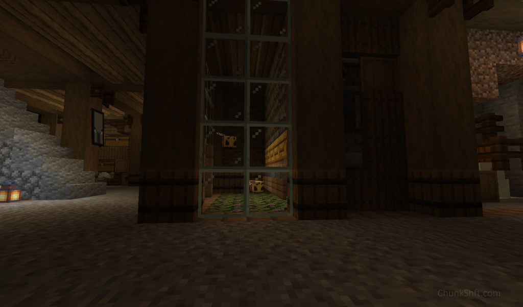 Two bees gather honey from azalea bushes recessed into the floor. Glass creates a small greenhouse for the bees. This all sits in the basement of a structure held up by spruce.