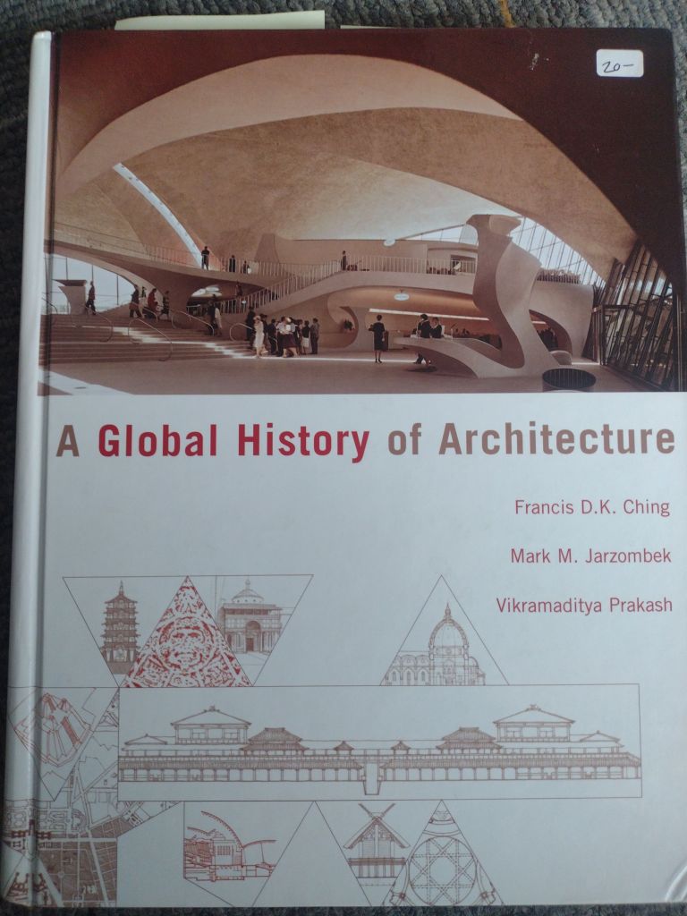 A hard cover book sits on a floor (IRL). It is "A Global History of Architecture" Authors; Francis D.K. Ching, Mark M. Jarzombek, Vikramaditya Prakash.