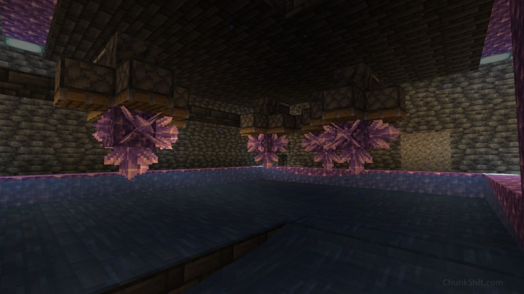 Amethyst clusters grow crystals while pistons wait above them. The clusters are all at the same z level. Below is flowing water for collection funneling towards the reader.