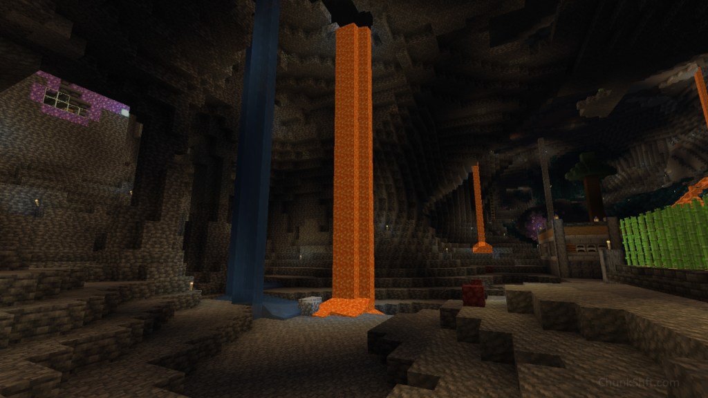 View from a back corner of the cavern. water and lava fall from an upper platform. On the right of the image previously built farms can be seen. On the left the bottom of the amethyst farm is visible.