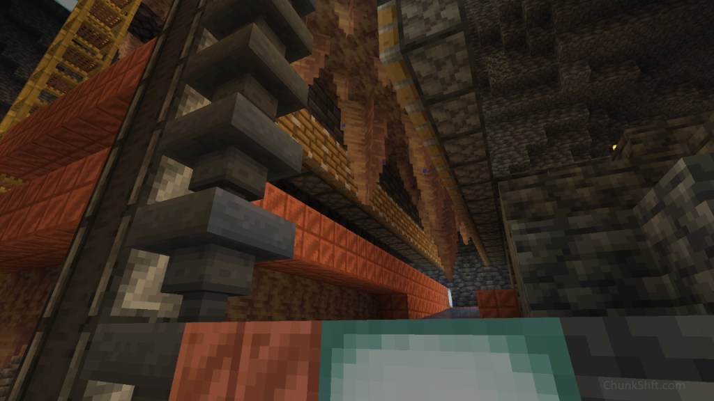 Hoppers and observers rise in two separate columns at the left of the image. Pointed dripstone stalactites hang in two rows between pistons.
A sea lantern is partially visible at the front of the image. These are throughout the farm designs for light. This part of the farm has not yet been encased in tinted glass.