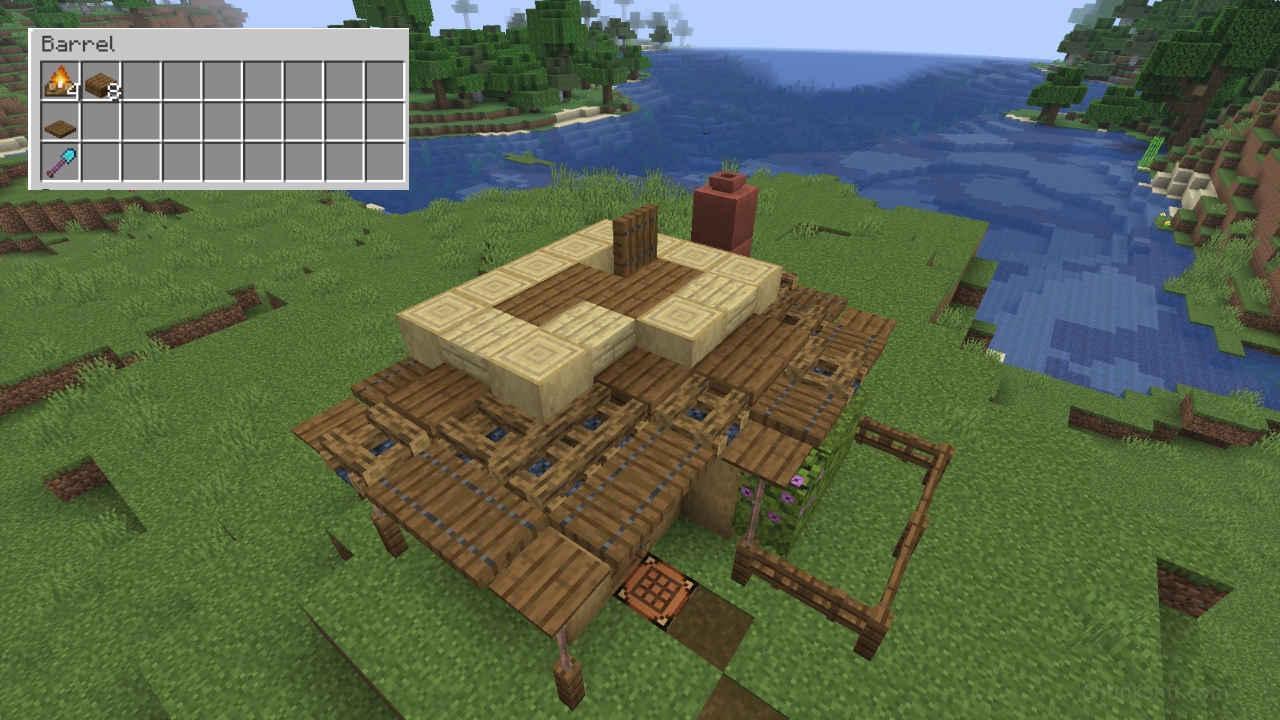 The second floor interior begins with spruce slab flooring and a single spruce trap door over the ladder.